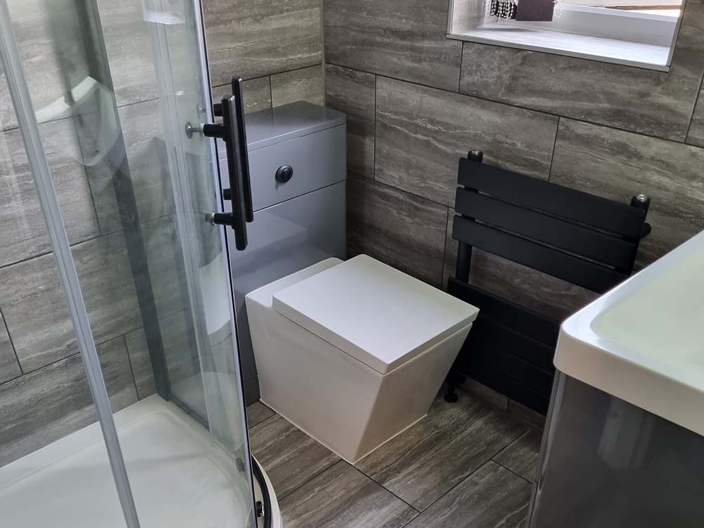 Square toilet in small bathroom